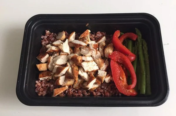 Brown rice, chicken, asparagus, and bell peppers