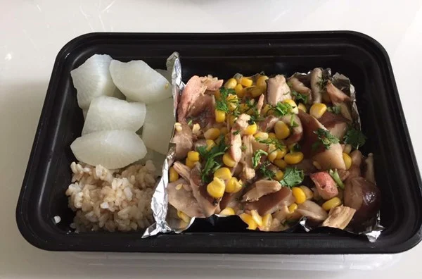 Brown rice, boiled radish and chicken, corn, and stir-fried mushrooms