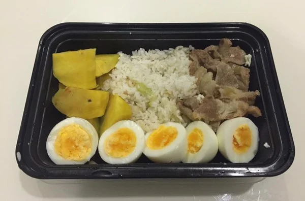 Sweet potatoes, boiled eggs, pork, and some white rice